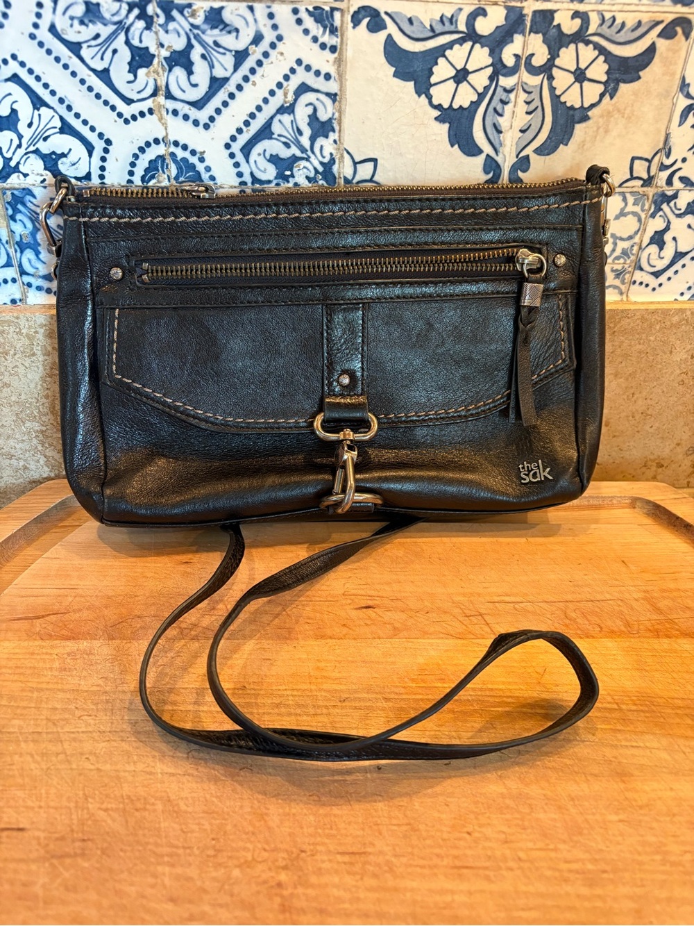 The Sak Black Leather Crossbody with Front Zip & Hardware